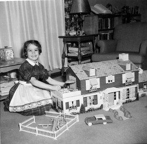 Debbie Solano, née Deborah Matteson, playing with her Marx-A-Mansion Dream House. Many mid-century homes in midtown Tulsa resemble this doll house.